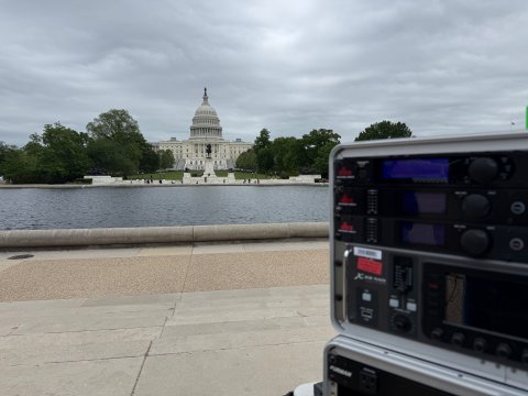 US Capitol building, reflecting pool, and audio equipment in Washington DC. 