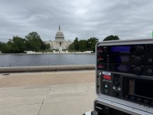 US Capitol building, reflecting pool, and audio equipment in Washington DC. 